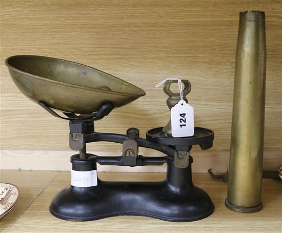 A set of scales and a shell casing